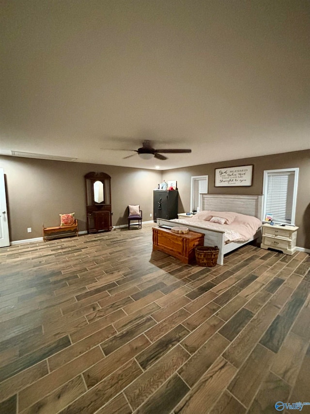 bedroom with ceiling fan and dark hardwood / wood-style flooring