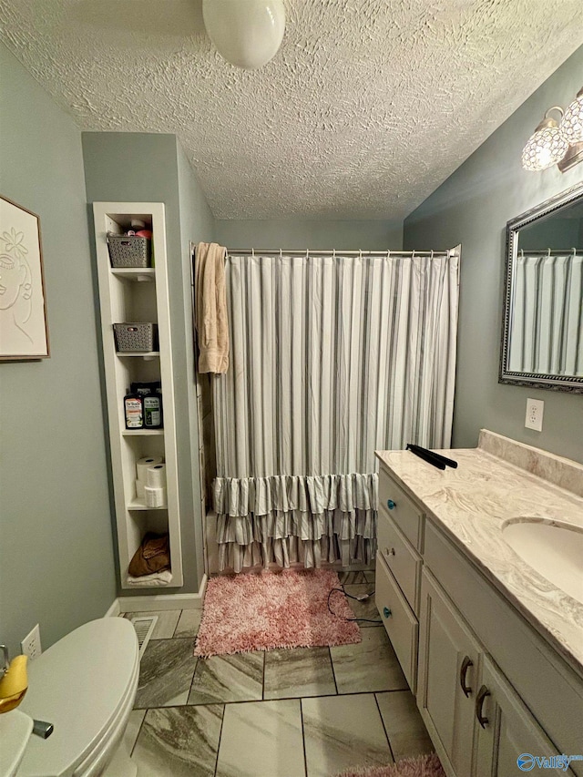 bathroom with vanity, a textured ceiling, toilet, and a shower with shower curtain