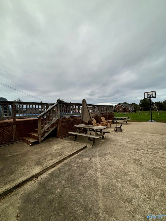 exterior space with a patio area, an outdoor fire pit, and a deck