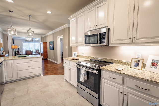 2522 Lindisfarne Dr SW, Decatur, AL 35603 - kitchen featuring stainless steel appliances, ornamental molding, light stone counters, white cabinets, and recessed lighting