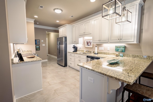 2522 Lindisfarne Dr SW, Decatur, AL 35603 - kitchen featuring stainless steel appliances, a peninsula, crown molding, light stone counters, and a kitchen bar