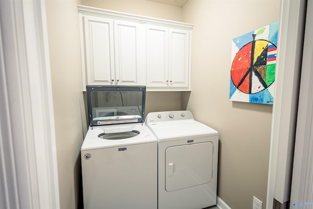 2522 Lindisfarne Dr SW, Decatur, AL 35603 - clothes washing area featuring washer and clothes dryer and cabinet space