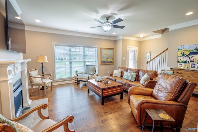 2522 Lindisfarne Dr SW, Decatur, AL 35603 - living area featuring a ceiling fan, wood finished floors, a fireplace, recessed lighting, and crown molding