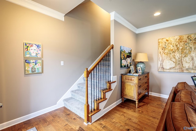 2522 Lindisfarne Dr SW, Decatur, AL 35603 - stairway featuring crown molding, wood finished floors, baseboards, and recessed lighting