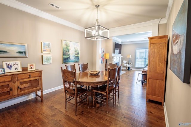 2522 Lindisfarne Dr SW, Decatur, AL 35603 - dining room featuring a chandelier, dark wood finished floors, baseboards, and ornamental molding