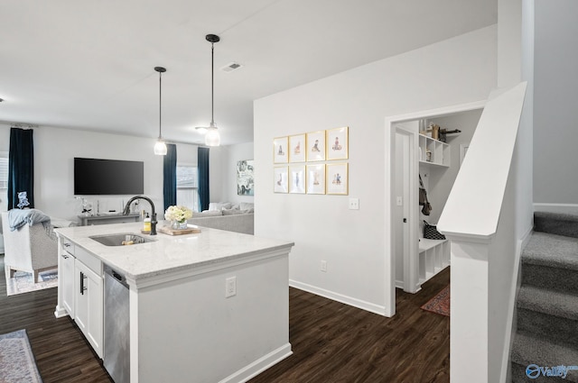 kitchen with open floor plan, dark wood-style flooring, and a sink