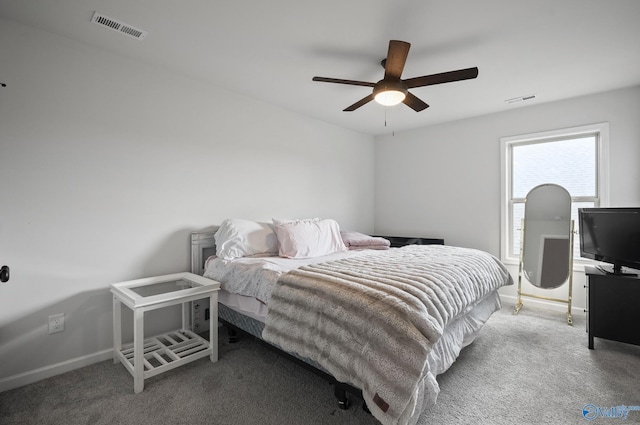 bedroom with carpet flooring, visible vents, and baseboards