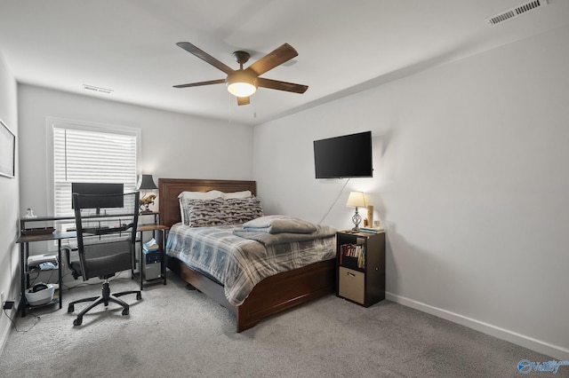 bedroom with visible vents, carpet floors, and baseboards