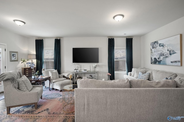 living room with a wealth of natural light and wood finished floors
