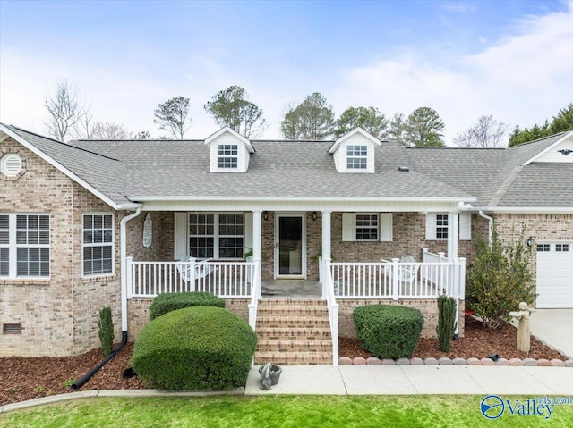 view of front facade with a porch and a garage