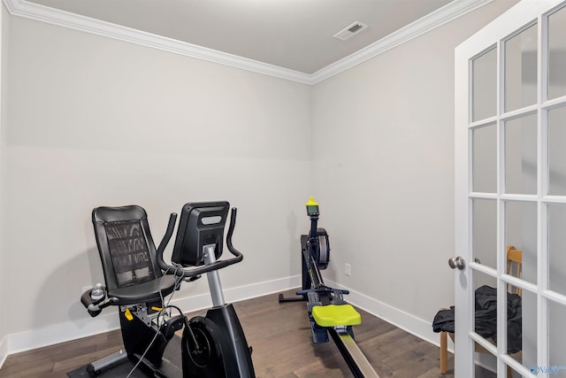 exercise area featuring hardwood / wood-style flooring, crown molding, and french doors