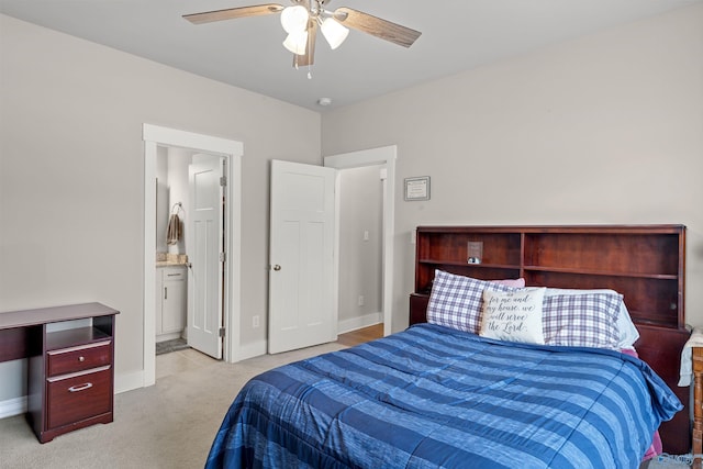 carpeted bedroom with connected bathroom and ceiling fan