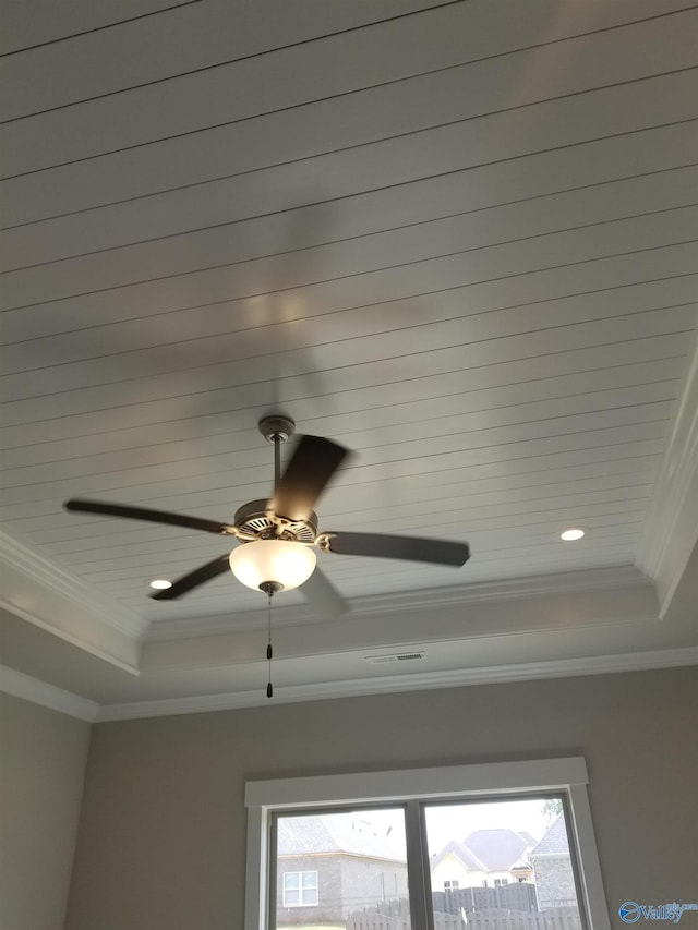 details with ornamental molding and a tray ceiling