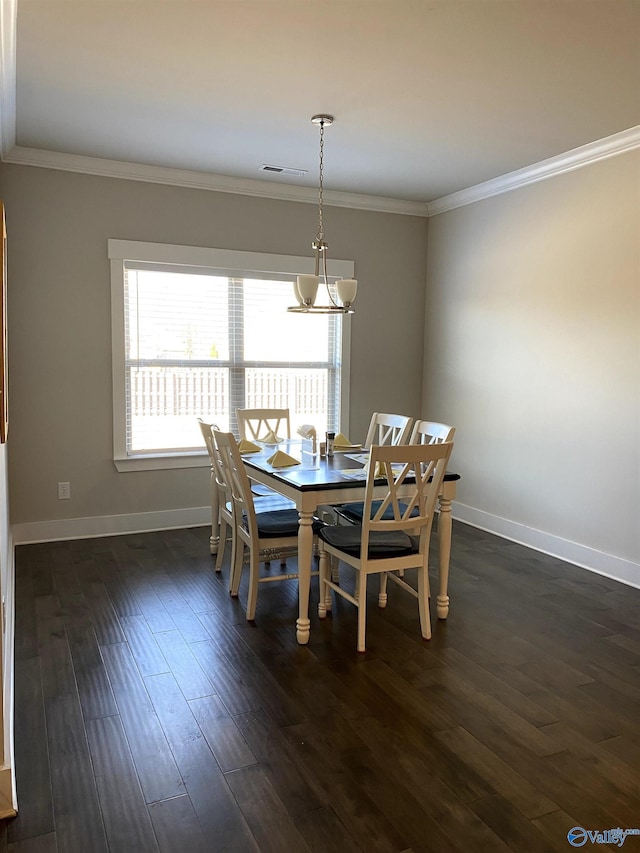 dining space with crown molding and dark wood-type flooring