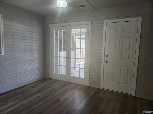 doorway to outside with visible vents, french doors, and wood finished floors