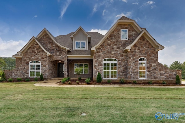 craftsman-style house with a front lawn