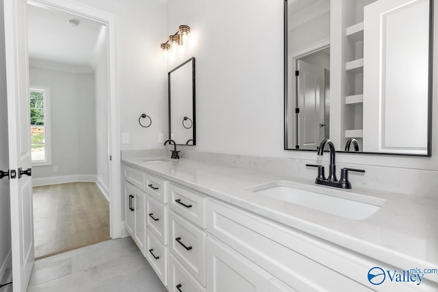 bathroom with vanity and ornamental molding