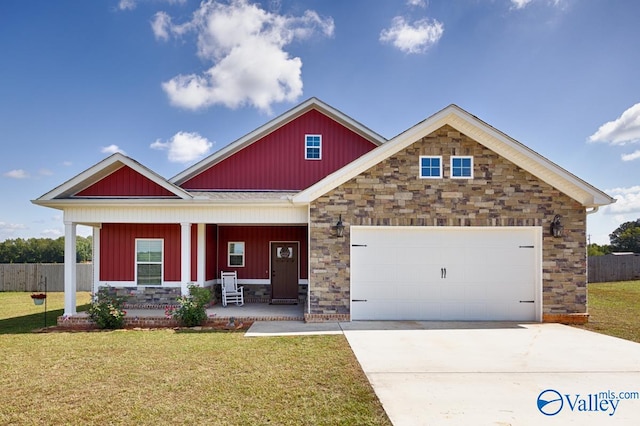 craftsman house featuring a porch, a garage, and a front yard