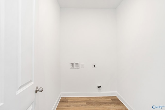 laundry area featuring hookup for a washing machine, wood-type flooring, and hookup for an electric dryer