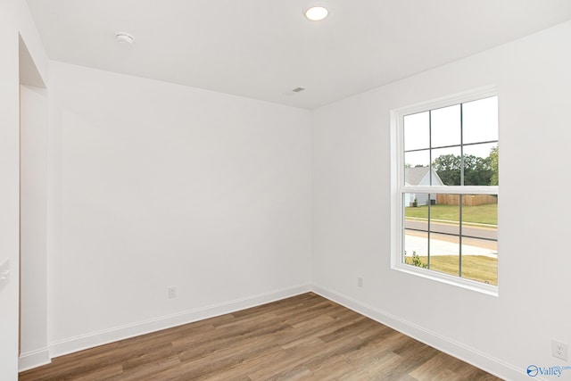 spare room featuring hardwood / wood-style floors