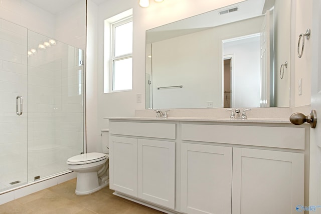 bathroom featuring tile patterned flooring, an enclosed shower, vanity, and a wealth of natural light