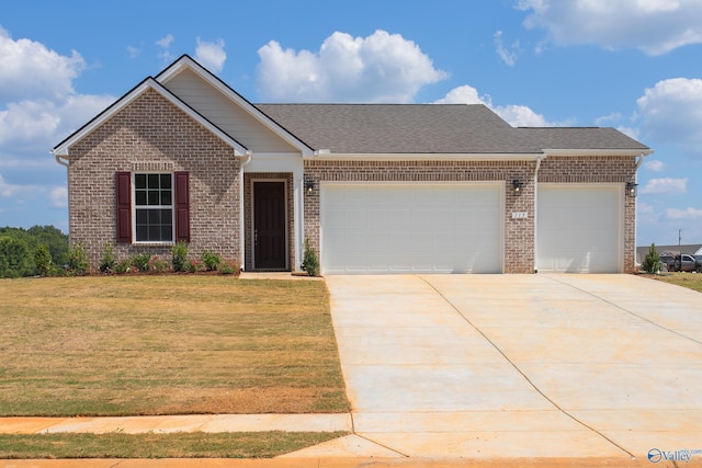 view of front facade with a garage and a front yard