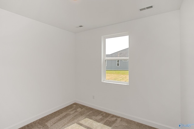 unfurnished room with carpet flooring