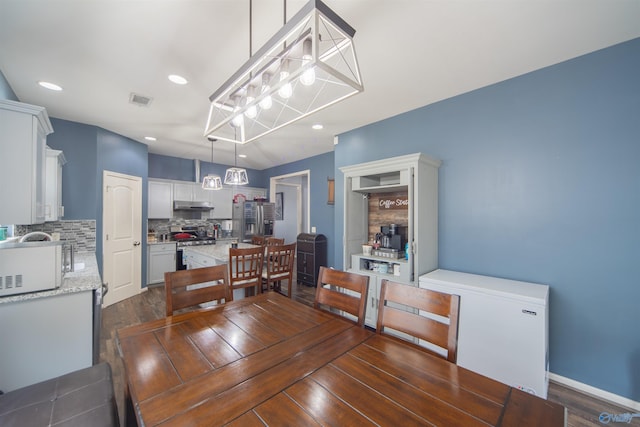 dining area with dark wood-type flooring