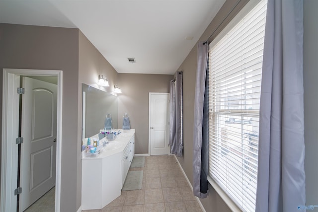 bathroom with vanity and tile patterned flooring