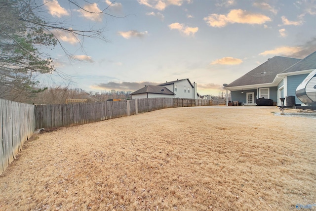 view of yard at dusk