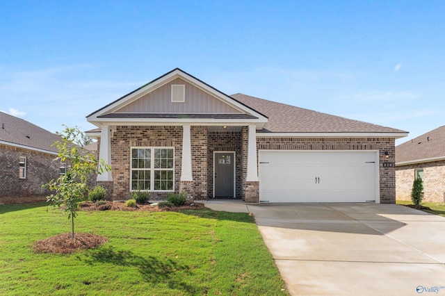 craftsman house with a garage and a front lawn