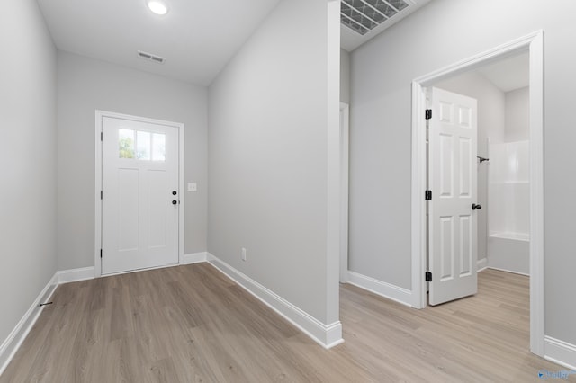 full bathroom featuring hardwood / wood-style flooring, shower / washtub combination, vanity, and toilet