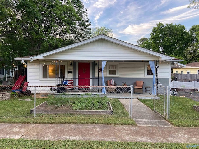 1213 Humes Ave NE, Huntsville, AL 35801 - bungalow-style house featuring a porch, fence private yard, and a front yard