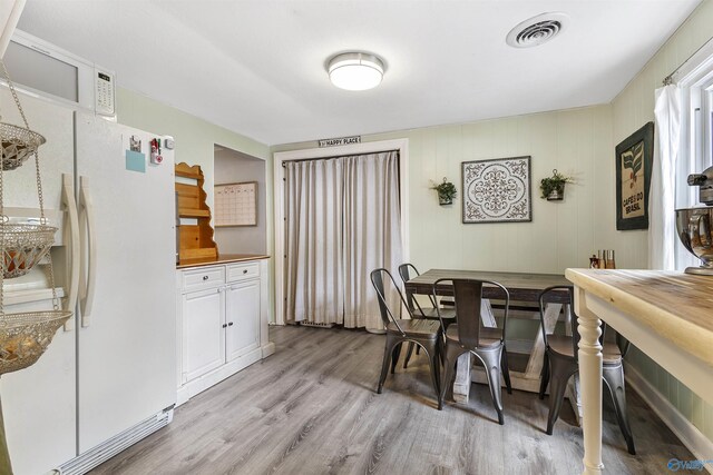 1213 Humes Ave NE, Huntsville, AL 35801 - dining space featuring baseboards, light wood-style flooring, and visible vents