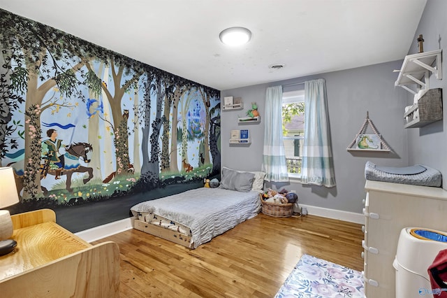 1213 Humes Ave NE, Huntsville, AL 35801 - bedroom featuring baseboards, visible vents, and wood finished floors