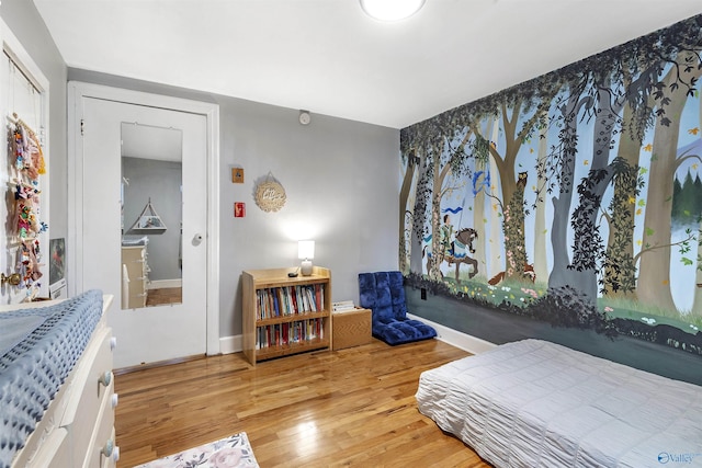 1213 Humes Ave NE, Huntsville, AL 35801 - bedroom featuring baseboards and wood finished floors