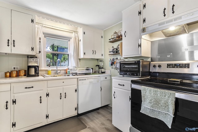 1213 Humes Ave NE, Huntsville, AL 35801 - kitchen featuring white dishwasher, under cabinet range hood, a sink, stainless steel range with electric cooktop, and light wood-style floors