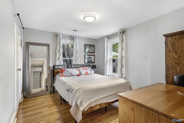 1213 Humes Ave NE, Huntsville, AL 35801 - bedroom featuring baseboards, light wood-style flooring, and visible vents