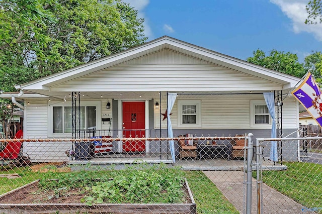 1213 Humes Ave NE, Huntsville, AL 35801 - bungalow with a vegetable garden, covered porch, and fence private yard