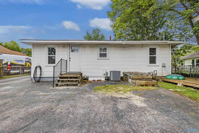 1213 Humes Ave NE, Huntsville, AL 35801 - back of property with cooling unit and fence