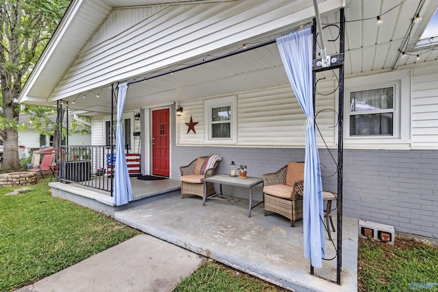 1213 Humes Ave NE, Huntsville, AL 35801 - doorway to property with covered porch and brick siding