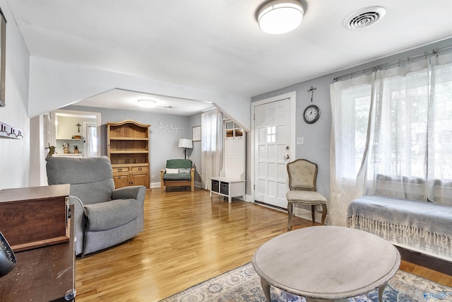 1213 Humes Ave NE, Huntsville, AL 35801 - living room featuring light wood finished floors and visible vents