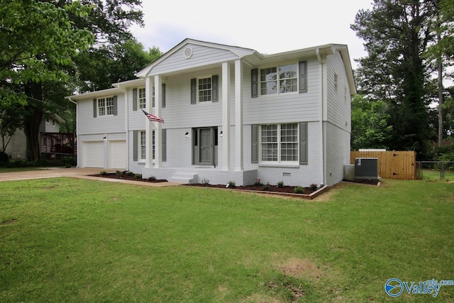 2520 Excalibur Dr SE, Huntsville, AL 35803 - neoclassical home featuring concrete driveway, a garage, brick siding, and central air condition unit