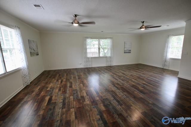 2520 Excalibur Dr SE, Huntsville, AL 35803 - empty room featuring ceiling fan, healthy amount of natural light, dark wood-style flooring, a textured ceiling, and ornamental molding