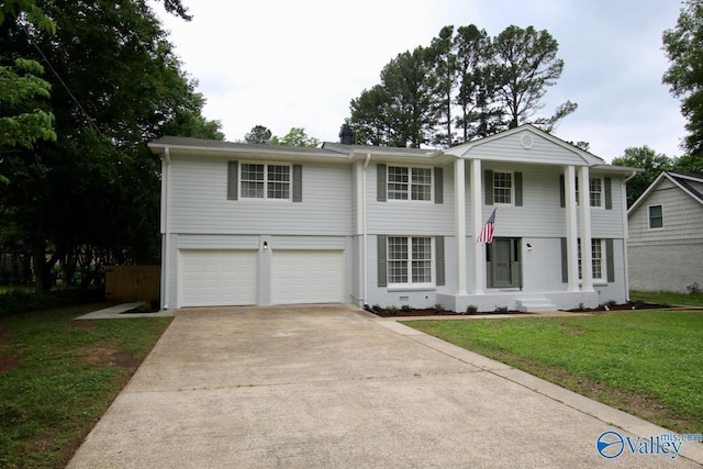2520 Excalibur Dr SE, Huntsville, AL 35803 - neoclassical home with concrete driveway, a garage, a front lawn, and a chimney
