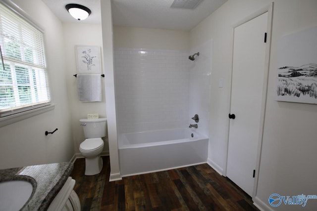 2520 Excalibur Dr SE, Huntsville, AL 35803 - bathroom featuring wood finished floors, toilet, tub / shower combination, and vanity