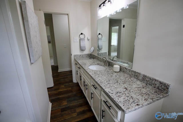 2520 Excalibur Dr SE, Huntsville, AL 35803 - bathroom featuring wood finished floors, vanity, and baseboards