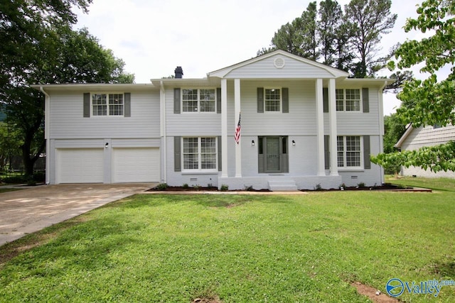 2520 Excalibur Dr SE, Huntsville, AL 35803 - greek revival inspired property with an attached garage, concrete driveway, a front yard, and a chimney