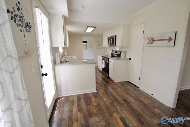 2520 Excalibur Dr SE, Huntsville, AL 35803 - kitchen featuring stainless steel appliances, dark wood finished floors, white cabinetry, and a sink