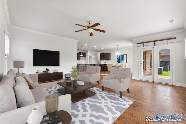107 Duchess Dr, Madison, AL 35758 - living room with crown molding, wood finished floors, ceiling fan, and recessed lighting